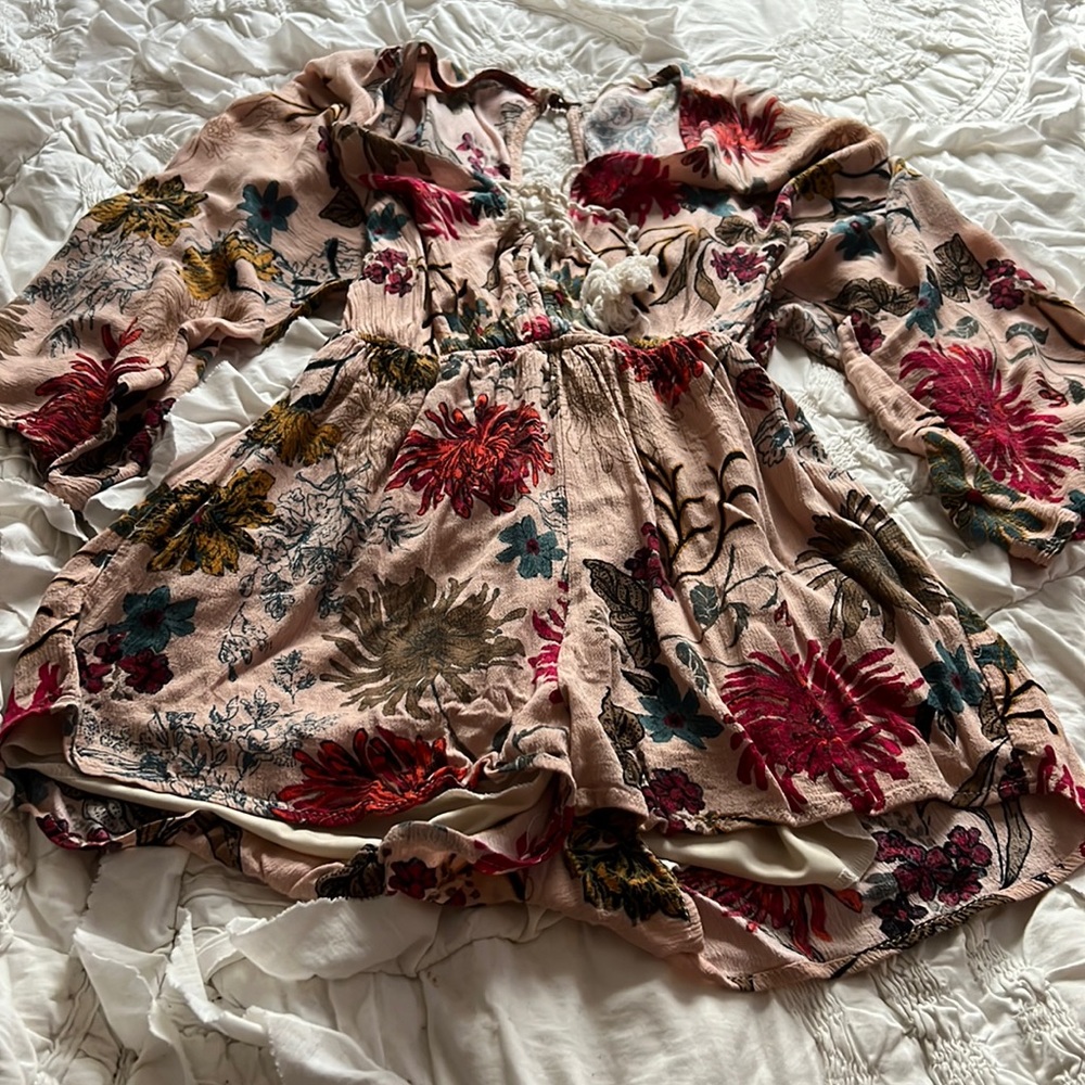 Floral quarter length romper, tie closure on the chest